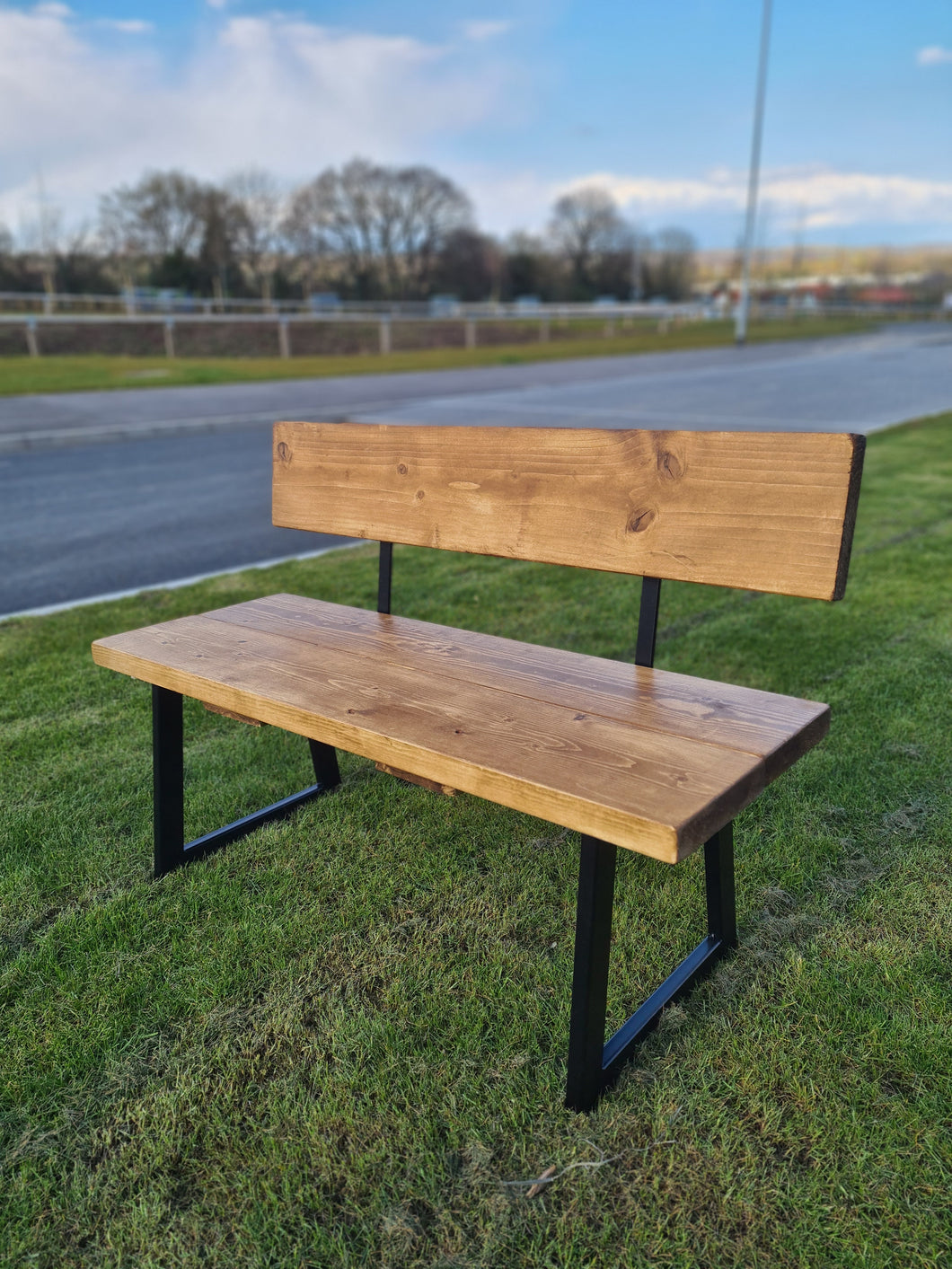 RUSTIC BACKED BENCH WITH TRAPEZIUM FRAME LEGS